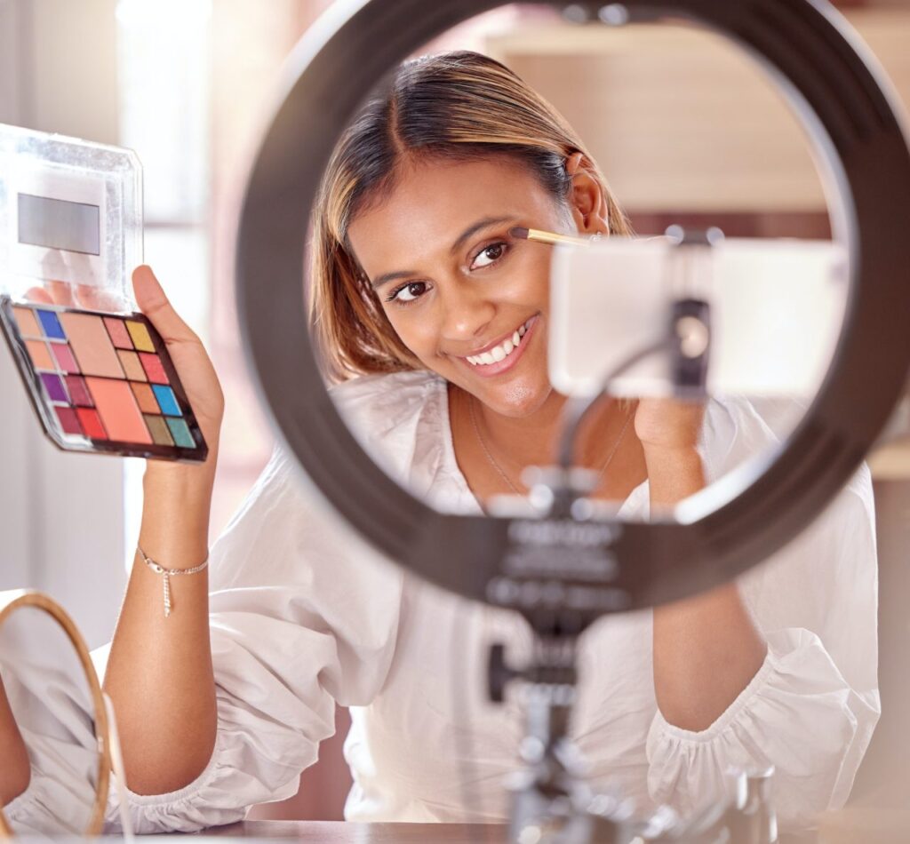 makeup live streaming and woman with eyeshadow and smile for beauty cosmetics and fashion vlog c